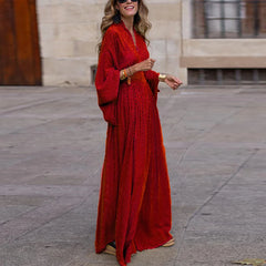 A woman wearing a stylish boho maxi dress with a pleated skirt and a relaxed fit, ideal for parties or casual wear.