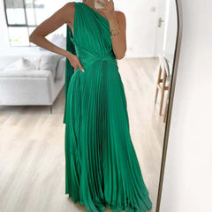 A woman wearing an elegant off-shoulder maxi dress with an oblique collar and pleated details.