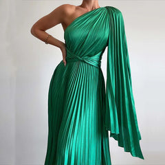 A woman wearing an elegant off-shoulder maxi dress with an oblique collar and pleated details.