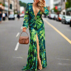 A woman wearing an elegant floral maxi dress with a flowing silhouette and a flattering fit.